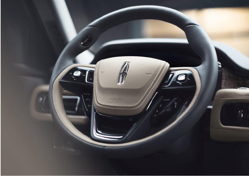 The intuitively placed controls of the steering wheel on a 2023 Lincoln Aviator® SUV | Preston Lincoln in Hurlock MD