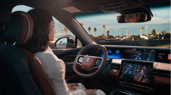 A person is shown driving hands-free on the highway with available Lincoln BlueCruise technology. | Preston Lincoln in Hurlock MD